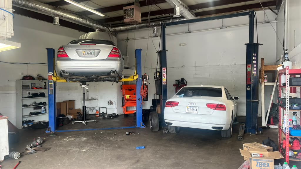 Mercedes and Audi on the lifts inside Euro Auto Works